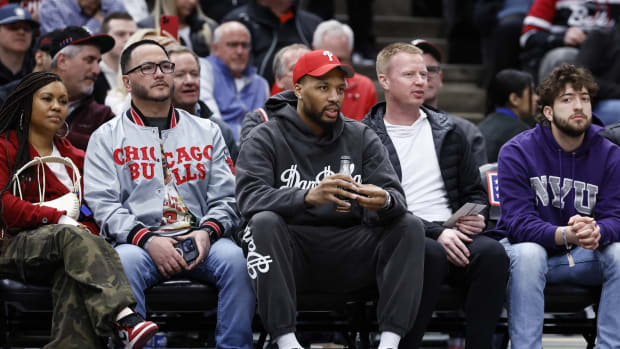  Milwaukee Bucks guard Damian Lillard attends a basketball game between the Chicago Bulls and Portland Trail Blazers 
