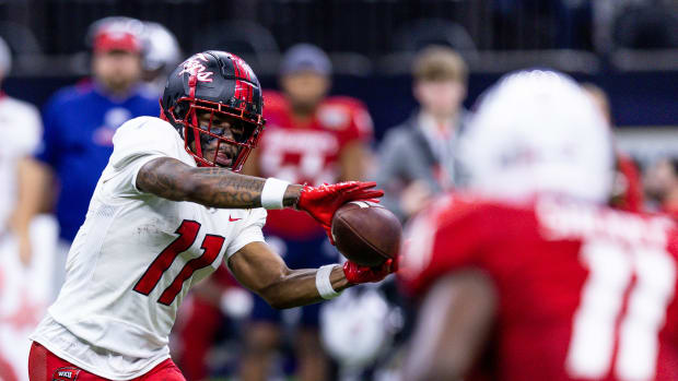 Dec 21, 2022; New Orleans, Louisiana, USA; Western Kentucky Hilltoppers wide receiver Malachi Corley (11) catches a pass against South Alabama Jaguars defensive lineman Jamie Sheriff (11) during the second half at Caesars Superdome. Mandatory Credit: Stephen Lew-USA TODAY Sports  