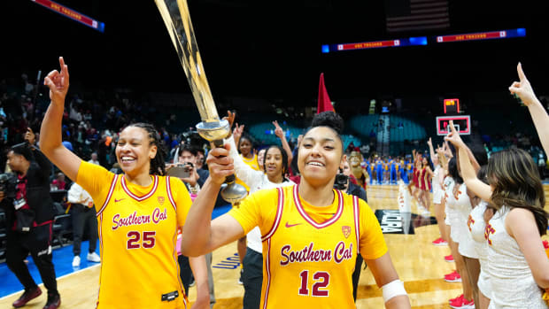 Mar 8, 2024; Las Vegas, NV, USA; USC Trojans guard JuJu Watkins (12) celebrates with USC Trojans guard McKenzie Forbes (25) after the Trojans defeated the UCLA Bruins 80-70 in double overtime at MGM Grand Garden Arena. 