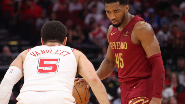 Mar 16, 2024; Houston, Texas, USA; Cleveland Cavaliers guard Donovan Mitchell (45) dribbles against Houston Rockets guard Fred VanVleet (5) in the second half at Toyota Center.