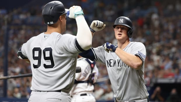 Aug 25, 2023; St. Petersburg, Florida, USA; New York Yankees third baseman DJ LeMahieu (26) is congratulated by right fielder Aaron Judge (99) after he hit a home run against the Tampa Bay Rays during the eighth inning at Tropicana Field. Mandatory Credit: Kim Klement Neitzel-USA TODAY Sports