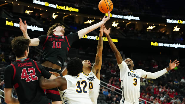 Mar 13, 2024; Las Vegas, NV, USA; Stanford Cardinal forward Max Murrell (10) tips a rebound away from California Golden Bears guard Keonte Kennedy (3) during the second half at T-Mobile Arena. Mandatory Credit: Stephen R. Sylvanie-USA 