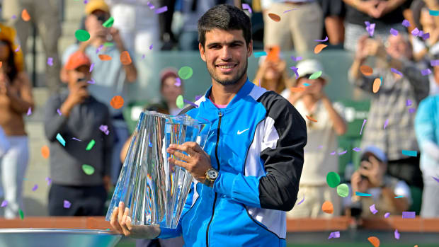 Carlos Alcaraz with the championship trophy after defeating Daniil Medvedev in the men’s final of the BNP Paribas Open at Indian Wells.