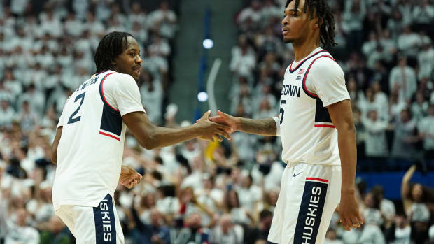 Feb 17, 2024; Hartford, Connecticut, USA; UConn Huskies guard Tristen Newton (2) reacts after his three point basket with guard Stephon Castle (5) as they take on the Marquette Golden Eagles in the second half at XL Center.