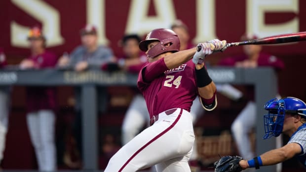 Florida State infielder Cam Smith (24) swings at the pitch. The Florida Gators defeated the Florida State Seminoles 9-5 on Tuesday, March 21, 2023. Fsu V Uf Baseball140  