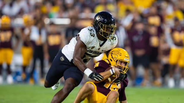 Arizona State Sun Devils quarterback Trenton Bourguet (16) is sacked by Colorado Buffaloes defensive end Arden Walker (53) in the second half at Mountain America Stadium
