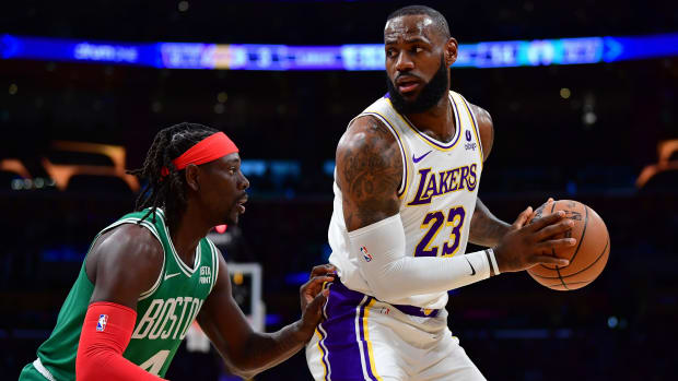 Los Angeles Lakers forward LeBron James and Boston Celtics guard Jrue Holiday.