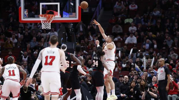 Chicago Bulls center Nikola Vucevic (9) shoots and scores against the Portland Trail Blazers during the second half at United Center. 