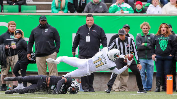 Nov 13, 2021; Huntington, West Virginia, USA; UAB Blazers wide receiver Trea Shropshire (11) attempts to dive for a touchdown while being tackled by Marshall Thundering Herd defensive back Steven Gilmore (3) during the first quarter at Joan C. Edwards Stadium. Mandatory Credit: Ben Queen-USA TODAY Sports