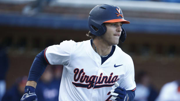 Henry Godbout runs to first during the Virginia baseball game against Georgetown at Disharoon Park.