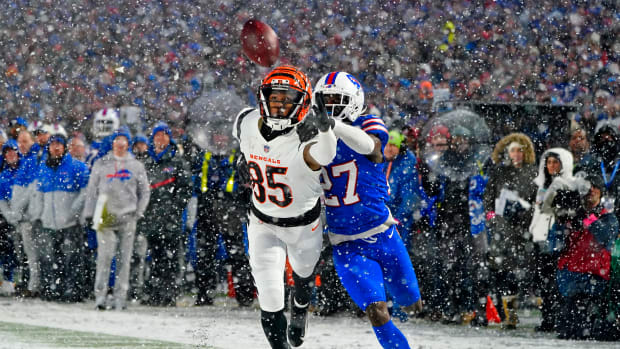 Jan 22, 2023; Orchard Park, New York, USA; Buffalo Bills cornerback Tre'Davious White (27) breaks up a pass and was penalized for pass interference against Cincinnati Bengals wide receiver Tee Higgins (85) during the fourth quarter of an AFC divisional round game at Highmark Stadium. Mandatory Credit: Gregory Fisher-USA TODAY Sports  