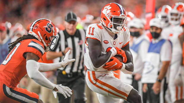 Clemson wide receiver Ajou Ajou (11) gets a first down during the second quarter at the Carrier Dome in Syracuse, New York, Friday, October 15, 2021. Ncaa Football Clemson At Syracuse  