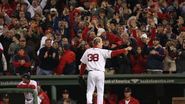 Oct 25, 2007; Boston, MA, USA; Boston Red Sox starting pitcher (38) Curt Schilling salutes the fans after being relieved in the 6th inning against the Colorado Rockies during game 2 of the 2007 World Series at Fenway Park.
