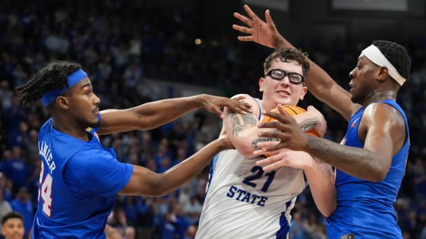 Indiana State Sycamores center Robbie Avila (21) recovers a rebound from Southern Methodist Mustangs guard Emory Lanier (24) on Wednesday, March 20, 2024, during the first round of the NIT at the Hulman Center in Terre Haute.