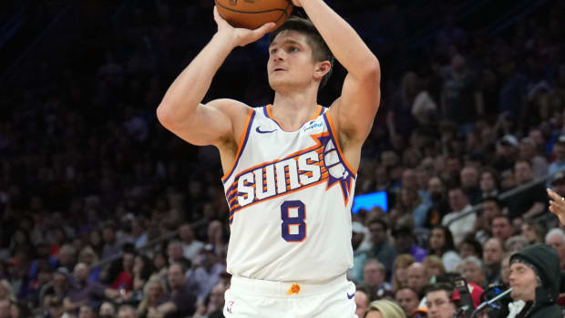 Phoenix Suns guard Grayson Allen (8) shoots against the Philadelphia 76ers during the first half at Footprint Center.