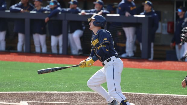West Virginia senior Reed Chumley watches his first of two home runs against Marshall.