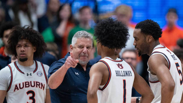 Auburn Tigers head coach Bruce Pearl directs his team during a break in the action against Florida during the SEC Men's Basketball Tournament Championship game at Bridgestone Arena in Nashville, Tenn., Sunday, March 17, 2024.
