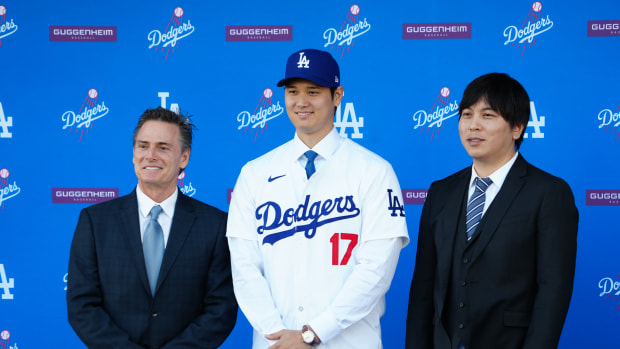 Dec 14, 2023; Los Angeles, CA, USA; Los Angeles Dodgers player Shohei Ohtani stands with his agent Nez Balelo (left) and interpreter Ippei Mizuhara at an introductory press conference at Dodger Stadium.