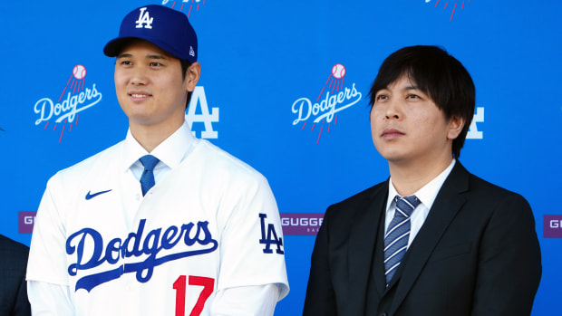 Shohei Ohtani, left, with his translator Ippei Mizuhara at an introductory press conference for the Dodgers