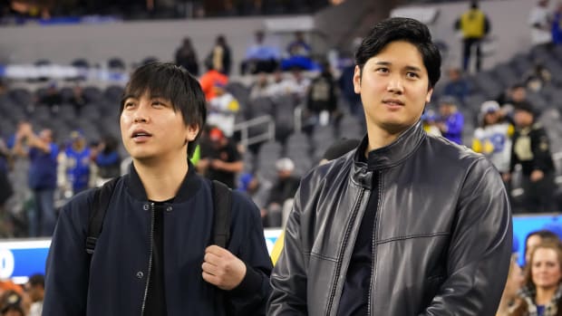 Dodgers superstar two-way player Shohei Ohtani (right) and long-time interpreter Ippei Mizuhara (left) attend a Los Angeles Rams game at SoFi Stadium.
