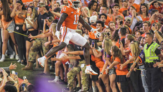 Clemson wide receiver Ajou Ajou (11) jumps up as he runs down the hill with the team, before the game with Boston College at Memorial Stadium in Clemson, S.C., October 2, 2021. Ncaa Football Acc Clemson Boston College  