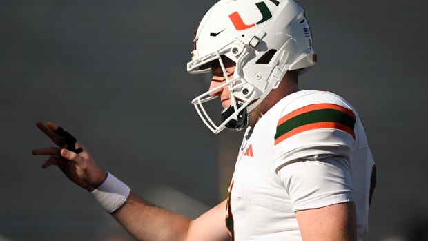 Nov 24, 2023; Chestnut Hill, Massachusetts, USA; Miami Hurricanes quarterback Tyler Van Dyke (9) waves to fans during warmups before a game against the Boston College Eagles at Alumni Stadium. Mandatory Credit: Brian Fluharty-USA TODAY Sports