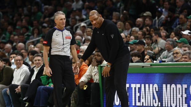  Milwaukee Bucks head coach Doc Rivers slumps down as he talks to referee Scott Foster (48) 