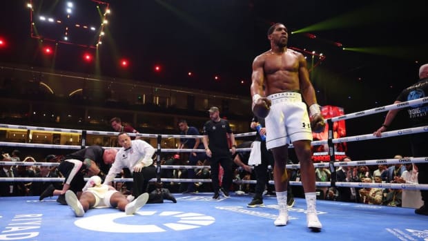 Francis Ngannou is knocked down  during the Heavyweight fight between him and Anthony Joshua on the Knockout Chaos boxing card at the Kingdom Arena. According to WBC president , Joshua would be accepted to challenge  Usyk or Fury for the undisputed heavyweight title. RICHARD PELHAM. 