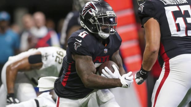 Falcons running back Damien Williams runs with the ball in a game vs. the Saints