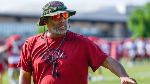 Razorbacks defensive line coach Deke Adams during Friday morning's practice on the outdoor fields