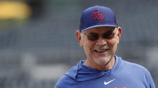Texas Rangers manager Bruce Bochy (15) smiles on the field before a game (2023)