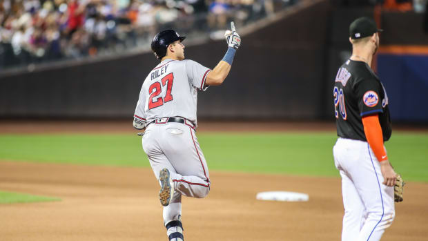 Aug 11, 2023; New York City, New York, USA; Atlanta Braves third baseman Austin Riley (27) points to the sky after hitting a solo home run in the seventh inning against the New York Mets at Citi Field.