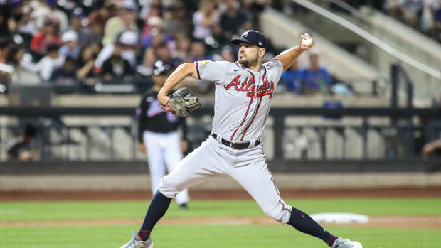 Aug 11, 2023; New York City, New York, USA; Atlanta Braves relief pitcher Brad Hand (45) pitches in the seventh inning against the New York Mets at Citi Field.