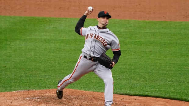 SF  Giants starting pitcher Aaron Sanchez delivers a pitch in the third inning against the Colorado Rockies at Coors Field. (2021)