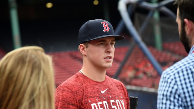 Boston Red Sox draft pick Kyle Teel speaks to a media member prior to a game against the New York Mets at Fenway Park.
