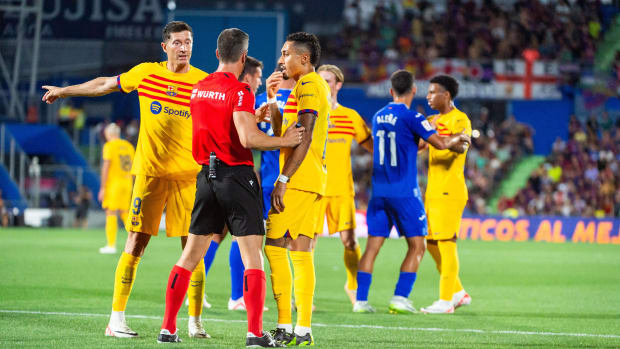 Barcelona forward Raphinha pictured (center) arguing with referee Cesar Soto Grado during an away game at Getafe in August 2023
