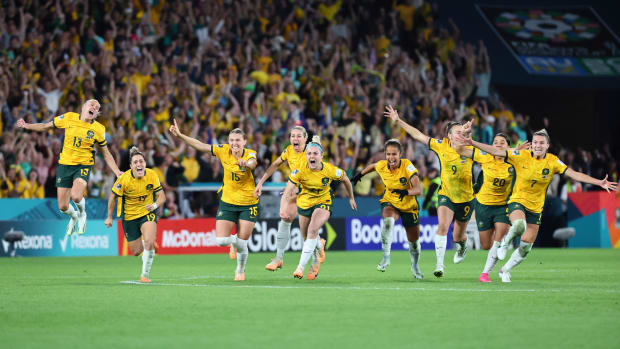 Australia players celebrate after beating France