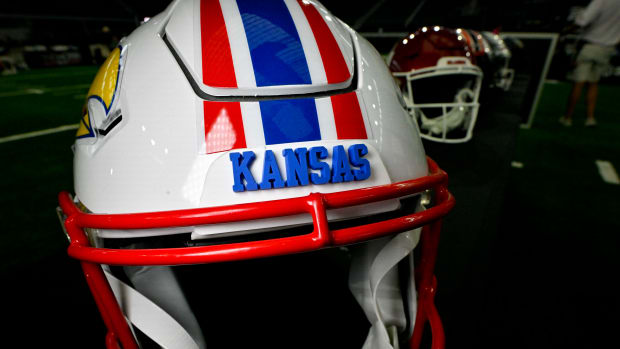 Jul 13, 2023; Arlington, TX, USA; A view of the Kansas Jayhawks helmet and logo during the Big 12 football media day at AT&T Stadium. Mandatory Credit: Jerome Miron-USA TODAY Sports  