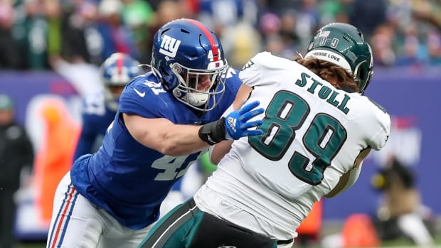Dec 11, 2022; East Rutherford, New Jersey, USA; New York Giants linebacker Micah McFadden (41) tackles Philadelphia Eagles tight end Jack Stoll (89) during the first quarter at MetLife Stadium.