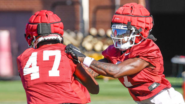 Razorbacks' defensive back Lorando "Snaxx" Johnson during workouts on the turf field on the outdoor practice field.