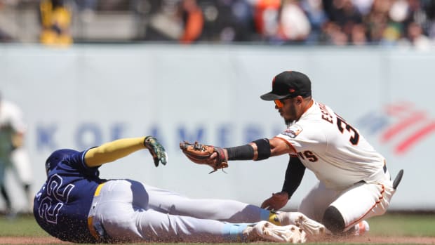 Rays outfielder Jose Siri is tagged out at second base by Giants second baseman Thairo Estrada.