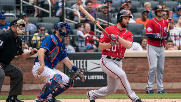 Jul 15, 2018; New York City, NY, USA; Washington Nationals second baseman Daniel Murphy (20) hits an rbi single during the seventh inning of the game against the New York Mets at Citi Field.