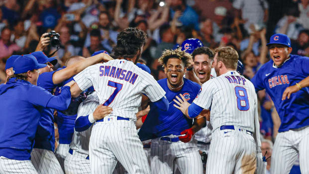 Aug 16, 2023; Chicago, Illinois, USA; Chicago Cubs second baseman Christopher Morel (5) celebrates with teammates after hitting a three-run walk-off home run against the Chicago White Sox during the ninth inning at Wrigley Field.