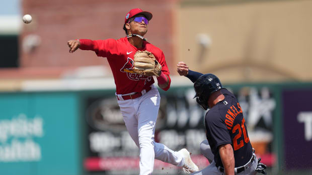 Mar 18, 2023; Jupiter, Florida, USA; St. Louis Cardinals second baseman Masyn Winn (80) attempts to turn a double as Detroit Tigers first baseman Spencer Torkelson (20) slides into first base in second inning.