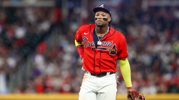 Aug 18, 2023; Atlanta, Georgia, USA; Atlanta Braves right fielder Ronald Acuna Jr. (13) runs to the dugout to change gloves against the San Francisco Giants in the ninth inning at Truist Park.