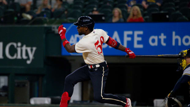 Aug 18, 2023; Arlington, Texas, USA; Texas Rangers center fielder J.P. Martinez (50) drives in a run against the Milwaukee Brewers during the ninth inning at Globe Life Field. Mandatory Credit: Jerome Miron-USA TODAY Sports