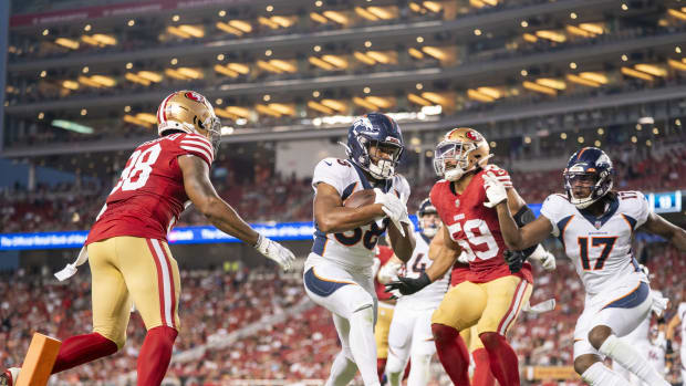 Denver Broncos running back Jaleel McLaughlin (38) scores a touchdown against the San Francisco 49ers during the fourth quarter at Levi's Stadium.