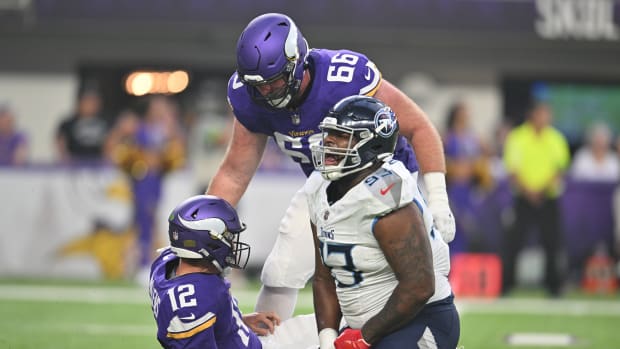 Tennessee Titans defensive tackle Teair Tart (93) reacts after knocking down Minnesota Vikings quarterback Nick Mullens (12) as Minnesota Vikings center Alan Ali (66) looks on during the first quarter at U.S. Bank Stadium.