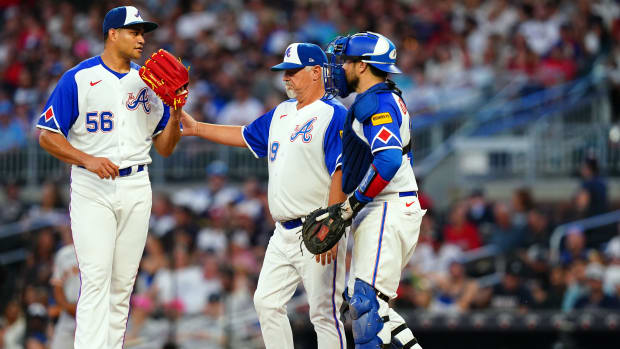 Aug 19, 2023; Cumberland, Georgia, USA; Atlanta Braves pitching coach Rick Kranitz (39) comes to the mound to talk with Atlanta Braves relief pitcher Yonny Chirinos (56) and Atlanta Braves catcher Travis d'Arnaud (16) during the fourth inning against the San Francisco Giants at Truist Park.