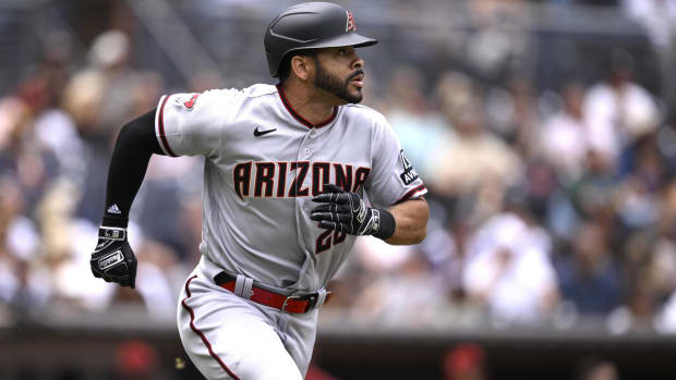 Diamondbacks outfielder Tommy Pham runs to first base in a game vs. the Padres.